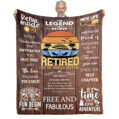 a man holding up a wooden sign with the words retired and some other things on it