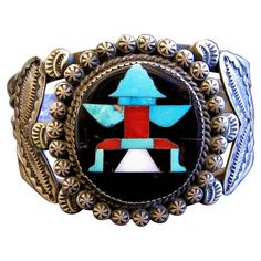 Strikingly beautiful historic Knife Wing design inlaid sterling silver cuff bracelet set with natural turquoise, spiny oyster shell, and mother of pearl inlaid into a black jet background. Made by the Zuni Master John Gordon Leak, also known as J. G. Leekety, specifically for and purchased by Robert Wallace, of the renowned Zuni trading family in 1938. Robert Wallace Collection, Wallace catalog inventory #RZ 124. Wonderful example of the finest stone-to-stone inlay by the Zuni Master John Gordon Leak. Inlaid element measuring 1 1/8 inches H. x 1 1/8 inches in Diameter. Bracelet measures 1 5/8 inches H. overall, 2.50 inches W. with inside measurement of 5 ¼ inches and a 1 ¼ inch opening. John Gordon Leak is considered one of the best of the first generation of Zuni stone carving and inlay a Jet Background, Wallace Collection, Wing Design, Tree Jewelry, Black Jet, Wings Design, Native Jewelry, Stone Inlay, Spiny Oyster