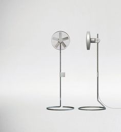 a couple of metal objects sitting on top of a white floor next to each other