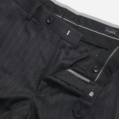 Complete your look with The Lakeshore Chalk Stripe Pants in Charcoal. Made from 100% wool, these pants feature a slim fit through the hips and thighs, with a tapered leg opening for a sleek finish. The arrow shape extension tab at the waistband adds a modern touch, while the lining to the knee ensures comfort even in warmer months. | Men's Tie Bar: The Lakeshore Chalk Stripe Pants - 31 30 31 / 30, In Dark Grey, Wool, Striped Classic Pinstripe Pants For Business Casual, Classic Pinstripe Bottoms For Business Casual, Fitted Pinstripe Pants With Tapered Leg, Fitted Pinstripe Tapered Leg Pants, Pinstripe Tapered Leg Dress Pants With Welt Pockets, Classic Custom Fit Bottoms For Business Casual, Custom Fit Bottoms With Welt Pockets For Business Casual, Pinstripe Tapered Leg Business Bottoms, Classic Pinstripe Business Pants