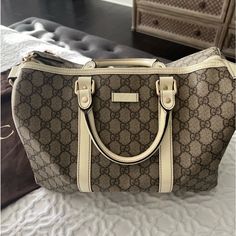 Gorgeous Top Handle Gucci Bag. Fits A Lot Amazing Condition No Scratches Barely Used. Comes With Storage Gucci Bag Gucci Travel Bag Women, White Gucci Shoulder Bag With Handles, White Gucci Bag With Handles, White Designer Gucci Bags, Luxury Gucci Cream Bag, Luxury Cream Gucci Bag, Pre-owned Beige Gucci Bag, Gucci Travel Bag, Travel Bag Women