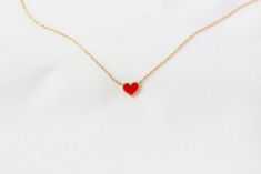 "*This listing is for one mini scarlet red enamel heart necklace, in solid 14K gold of your choice and choice of chain length. (pictured in solid 14K yellow gold) Meet our cutest and most cheerful enamel heart necklace with a pop of colour. Each necklace features a petite heart with meticulously hand applied enamel in solid 14K gold of your choice. This dainty necklace wears well on its own, and are also perfect for layering with any of our pieces. Specifications: - Solid 14K gold of your choice  - Hand applied coloured enamel (scarlet red) - approximately 0.8cm wide - Chain length customisable, please select on dropbox - 16-18\" length option comes with loops that adjusts the necklace to 16\", 17\" and 18\" respectively. please send a DM if you would like to have it made in other adjustab Ruby Eternity Ring, Velvet Ring Box, Big Diamond, Gold Hand, Eternity Band Ring, Gold Hands, Handmade Jewellery, Dainty Necklace, Necklace Handmade