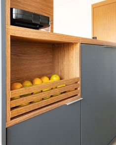 an open cabinet with some fruit in it