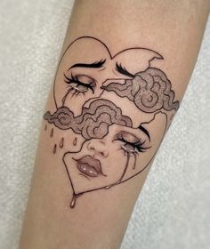 a woman's face with clouds and rain coming out of her eyes tattoo on the leg