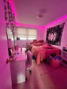 a bedroom with pink lighting and a bed