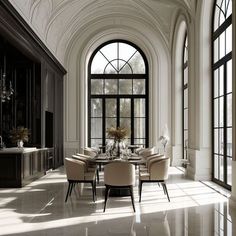 an elegant dining room with high ceilings and large windows