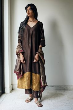 Bark brown kurta with floral block print on the sleeves and cutdana embellishment. Comes with straight pants.
Component: 2
Print
Neckline: V neck
Sleeve Length: Half
Fabric: Chanderi
Color: Brown
Gold trim at the hem
Block printed pant
Side slits
Note: Dupatta worn by the model is not for sale - Aza Fashions V Neck Kurta, Velvet Kurta, Kurta Designs Women, Kurta With Pants, Velvet Pants, Fashion App, Kurta Designs, Pant Set, Indian Design