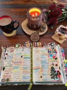 an open bible next to a cup of coffee and some other items on a table