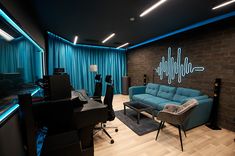 a living room filled with furniture and blue curtains