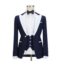 Redefine your look with the Custom Navy Tuxedo With White Lapel. Shop the finest men's navy tuxedo suits and enjoy free delivery.  Package Includes: 1 x Jacket - 1 x Waistcoat - 1 x Pant   	Fabric: 100% Wool  	Yarn: 120s  	Lining Fabric: Silk  	Pattern: Solid  	Construction: Half Canvas  	Seasonality: All Season  	Jacket: White Peak Lapel, Straight Pockets, Single Button Closure  	Waistcoat: White Peak Lapel with 3 Buttons Closure  	Trouser: Flat front, White Stripe, Buckle Adjuster, 2 Back Pock Navy Blue Tuxedo, Navy Tuxedo, Navy Tuxedos, Blue Tuxedo, Navy Blue Tuxedos, Lapel Top, Blue Tuxedos, Silk Pattern, Tuxedo Suit