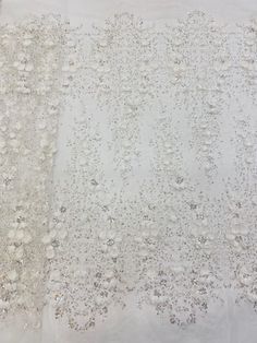 This high quality Fabric is measured in 5 Yards With Embroidered Beading and Sequin. It is soft, very delicate and beautiful. This high Quality Fabric is made with Fashion embroidered rhinestones can be used in making party wedding dresses, skirts, shawls, scarves and other other fashion apparels as you would like. Size : Length : 5 yards (180 inch). Width: 50 inch (Please allow slight deviation for the measurement data ,±1 inch) Material: 100% Polyester, Tulle Lace Fabric, Eco-Friendly embroide White Embellished Organza Embroidered Fabric, Elegant Silver Embroidered Organza Fabric, Elegant Embroidered Fabric With Rhinestones For Party, Elegant Embroidered Fabric With Rhinestones For Wedding, Elegant White Beaded Embroidered Fabric, Elegant Embellished Embroidered Organza Fabric, Elegant Rhinestone Embroidered Fabric For Weddings, Elegant Beaded Sequin Fabric For Wedding, Elegant White Embroidered Beaded Fabric