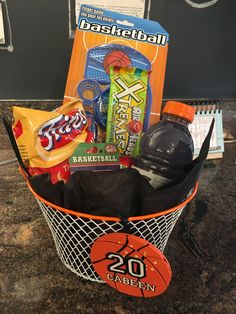 a basket filled with sports snacks and drinks