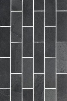 a black and white tile floor with squares