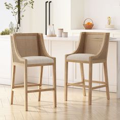 two wicker bar stools in a kitchen