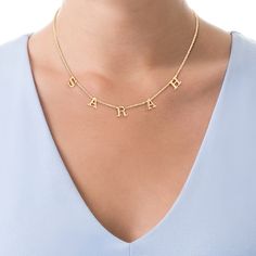 The style is in the spelling with this smart personalized charm necklace. Fashioned in sterling silver with 14K gold plate, this 1/4 x 1/4-inch design features the letters of her name - between three and ten characters in length - each sculpted in an uppercase block font as charms that freely slide along the chain. Polished to a bright shine, this look suspends along an 18.0-inch cable chain that secures with a spring-ring clasp. Yellow Gold Nameplate Initial Necklace For Personalized Gift, Sterling Silver Name Necklace With Initials In Yellow Gold, Personalized Yellow Gold Initial Necklace With Custom Name, Personalized Yellow Gold Initial Nameplate Necklace, Personalized Yellow Gold Nameplate Initial Necklace, Personalized Initials Yellow Gold Name Necklace, Personalized Gift Yellow Gold Initial Nameplate Necklace, Custom Name Yellow Gold Sterling Silver Initial Necklace, Personalized Name Charm Necklace In Yellow Gold