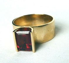 Vintage 14k Gold SKAL2.50Ct Mid Century Modernist Wide Tension Set Cocktail Ring Vintage 14k Gold SKAL2.50Ct Mid Century Modernist Wide Tension Set Cocktail Ring Click images to enlarge Description Offered today is a well-made, solid 14k yellow gold mid-century modernist  garnet ring, signed SKAL.  I set out to find out who stamps/ stamped their jewelry SKAL, and this trademark was used by the Skalet Jewelry Co. of NYC, with its inception in the 1940s.  As far as I can see, the trademark no longer exists.  (Many eBay sellers are incorrectly listing this SKAL stamp as belonging to a German designer, Hubertus Von Skal, but this is not his work.  A German ring would NOT have USA hallmarks of 14k; it would have German assay marks).  Anyway, I digress. This is a REALLY NICE RING and very unique Modernist Jewelry Rings, Vintage Modernist Jewelry, Vintage Cocktail Ring, Modernist Ring, Tension Setting, Modernist Jewelry, Garnet Ring, Inception, Garnet Rings