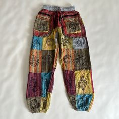 Not Sure How To Even Describe These Unique Pants! 100% Cotton. Striped Colorful Pants With Lots Of Various Graphics And Symbols. Peace Sign, Sunshine, Spirals, Ethnic. Nwt. Size Small. Zipper And Front Velcro Pockets! Bin 1 Colorful Casual Bottoms With Pockets, Colorful Cotton Wide Leg Pants, Colorful Wide Leg Cotton Pants, Colorful Casual Cotton Pants, Casual Colorful Cotton Pants, Casual Cotton Bottoms With Colorful Pattern, Red Cotton Ankle-length Harem Pants, Red Ankle-length Cotton Harem Pants, Colorful Summer Cotton Pants