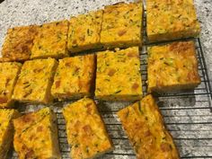 there are many square pieces of food on the cooling rack and it is ready to be eaten