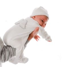 a baby is being held up in the air