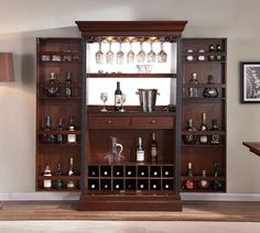 a wooden shelf filled with lots of bottles and glasses