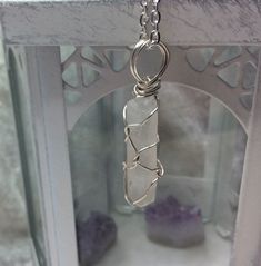 Raw Clear Crystal Rock quartz shard prism point pendant necklace This lovely quartz point is securely enclosed and suspended in the wirework using silver filled wire. The pendant is approximately 44mm x 10mm (1.6 inches x 0.45 inches) The pendant comes with either a 925  sterling silver or silver plated chain or a black leather cord or black cord with a choice of lengths. Clear Quartz is also known as Crystal Quartz or Rock Crystal. It is a 10th Anniversary gemstone. Chakras - Crown Chakra Zodia Chakras Crown, April Birthstone, 10th Anniversary, Crown Chakra, Clear Quartz Crystal, Quartz Points, Crystal Quartz, Wire Work, Quartz Necklace