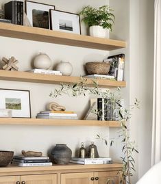 a living room filled with furniture and shelves