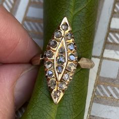 Sweet Victorian 14K yellow gold & rose cut diamond ring in a marquise shape! There are 17 rose cut diamonds across the front of the ring in a marquise setting. The diamonds measure 1.5mm to 2.25mm each, and have natural inclusions. Please ask all necessary questions prior to placing an order. Measurements: The size is 6 US, and can be sized for a fee. Condition: The overall all condition of this ring is very good. 14k Gold Marquise Diamond Ring With Single Cut Diamonds, Marquise Rose Cut Yellow Gold Jewelry, Heirloom Marquise Diamond Ring With Single Diamond, Victorian Marquise 14k Gold Ring, Antique Marquise Diamond Ring With Diamond Cut, Victorian Diamond Ring With Marquise Rose Cut, Victorian 14k Gold Marquise Rings, Victorian Marquise Diamond Ring With Single Cut Diamonds, Gold Pear-shaped Rose Cut Diamond Ring