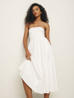 Big easy.  Shop the Astoria Dress from Reformation, a strapless midi length dress with pockets. Extra Dresses, Engagement Photo Outfit Ideas, Catherine Mcneil, Jessica Alba Style, Marriage Material, Engagement Photo Outfit, White Strapless Dress, Photo Outfit Ideas, Feminine Outfits