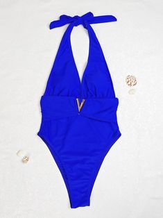 Indulge in the allure of the seaside with our Sexy Deep V Neckline One-Piece Bikini Swimsuit. This alluring swimsuit features a captivating deep V neckline that accentuates your curves, creating a sensual and sophisticated look. Crafted with high-quality materials, it offers both comfort and style for your beach adventures or poolside lounging. With its daring design and flattering fit, this bikini swimsuit is sure to turn heads wherever you go. Flaunt your confidence and embrace your femininity Backless Lined Swimwear For Beach Party, Backless One Pieces For Pool Beachwear, Backless One-piece Swimwear For Pool, Backless Beachy Swimwear For Pool, Backless Beachwear One-piece For Pool, Beachy Backless Swimwear For Pool, Beachwear One Piece Halter Neck For Sunbathing, Beachwear One-piece With Halter Neck For Sunbathing, Beachy Halter Neck Swimwear For Pool