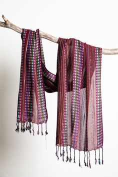 This retro striped scarf is as a fun and funky throwback to the hippie style and bohemian counterculture of yesteryear. With a variety of colors and patterns accented by dots and stripes, this unique lightweight scarf is a perfect colorful accent to any outfit. Which one will you get? Purple Festival Scarves, Multicolor Woven Scarf One Size, Multicolor Woven Scarves One Size, Purple Bohemian Scarf One Size, Purple Bohemian Scarf, One Size, Bohemian Purple Scarf One Size, One Size Purple Bohemian Scarf, One Size Bohemian Purple Scarf, Hippie Multicolor Scarf One Size