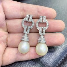 We are presenting you a HUGE pair of Art Deco, CHANDELIER, Genuine, LUSTROUS PURE WHITE, South Sea Pearls, extremely FINE AA+, LUSTROUS and Rare! Accenting the 2 pearls are 98 pieces of E/VS Natural diamonds, weighting a total of 1.58 carats. Set in GORGEOUSLY designed 18K solid white gold Art Deco earrings! PERFECT FOR SPECIAL OCCASIONS! SO BIG AND GORGEOUS! EVERYONE WILL FALL IN LOVE WITH THEM THE MINUTE THEY SEE YOU WEARING THEM! ONLY ONE ITEM AVAILABLE!! NO DUPLICATES!! WHAT YOU SEE IN THE P Luxury Diamond Pearl Earrings For Wedding, White Diamond Pearl Earrings For Wedding, Elegant White Round Chandelier Earrings, Luxury White Chandelier Earrings For Evening, Elegant Cream Pearl Earrings For Formal Occasions, Luxury Chandelier Dangle Earrings For Wedding, Luxury Pear-shaped Wedding Earrings, Luxury Wedding Chandelier Dangle Earrings, Luxury White Chandelier Earrings