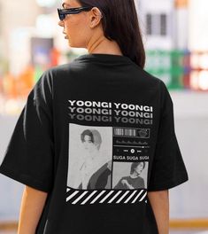 a woman wearing a t - shirt that says yoonggi yoonggi on it