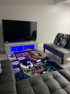 a living room filled with furniture and a flat screen tv