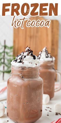 two mason jars filled with hot chocolate and whipped cream