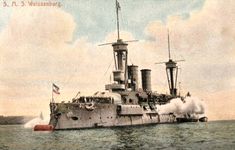 an old photo of a battleship in the water