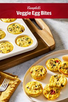 egg muffins on a plate next to a baking tray and utensils