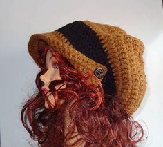 a woman with red hair wearing a knitted hat