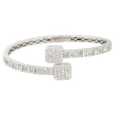 14k White Gold 2.40ctw Round and Baguette Shaped Diamond Cuff Bracelet Raymond Lee Jewelers in Boca Raton -- South Florida’s destination for diamonds, fine jewelry, antique jewelry, estate pieces, and vintage jewels. Style: Women's Diamond Crossover Cuff Bracelet Material: 14k White Gold Diamond Details: Approx. 2.40ctw of Round and Baguette Cut Diamonds Size: Will fit a 6.5" wrist Additional Details: This item comes with a presentation box! SKU: A30315725 Raymond Lee, Diamond Cuff Bracelet, Modern Bracelets, Baguette Cut Diamond, Women Diamond, Vintage Jewels, Diamond Sizes, South Florida, White Gold Diamonds