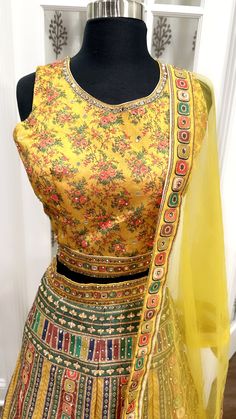 Discover elegance with this simple and sober silk Haldi lehenga in a beautiful floral and multicolor print. Size 42, featuring a net dupatta. Perfect for a sophisticated and understated look Multicolor Chanderi Lehenga With Pallu, Bollywood Style Multicolor Chanderi Lehenga, Bollywood Style Art Silk Multicolor Lehenga, Festive Silk Choli With Floral Print, Bollywood Style Multicolor Art Silk Lehenga, Festive Floral Print Choli With Traditional Drape, Multicolor Chanderi Lehenga With Sheer Dupatta, Multicolor Chanderi Lehenga With Zari Work, Traditional Designer Choli With Floral Print