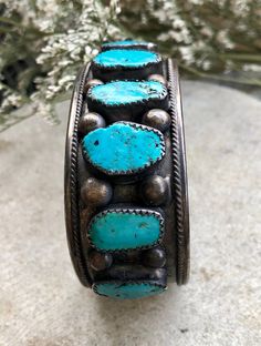 Circa Raw Sleeping Beauty Turquoise Sterling Silver Native American Vintage Antique Cuff Bracelet has lots of beautiful patina Face measures 1 inch wide inner diameter of 6 inches plus a 1/2 inch gap, slightly adjustable Antique Turquoise Adjustable Bracelet, Antique Adjustable Turquoise Bracelet, Handmade Turquoise Vintage Cuff Bracelet, Vintage Turquoise Bangle Cuff Bracelet, Vintage Turquoise Bangle As A Gift, Antique Turquoise Bangle Cuff Bracelet, Antique Turquoise Cuff Bracelet As Gift, Antique Turquoise Cuff Bracelet Gift, Antique Turquoise Cuff Bracelet For Gift