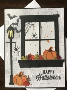 a card with a window and pumpkins on it