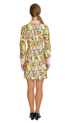 SALE! 2 left! Vibrant Floral Autumn Shirt Dress; a versatile and delightful addition to your wardrobe. This dress features a vibrant floral pattern that adds a casual elegance to your ensemble, making it perfect for both work and play. The classic pink collar, cuffs, and button down detailing provide a charming contrast against the floral backdrop. With its casual yet sophisticated style, this dress carries confidently across all environments, from the classroom to a concert hall. Embrace the vi Fitted Floral Print Dress For Fall, Long Sleeve Floral Dress For Spring, Feminine Fitted Long Sleeve Shirt Dress, Fall Floral Print Collared Dress, Collared Floral Print Dresses For Fall, Summer Floral Print Long Sleeve Shirt Dress, Spring Floral Long Sleeve Dress For Daywear, Printed Collared Day Dresses, Long Sleeve Floral Dress For Spring Daywear