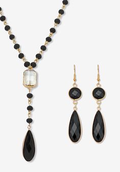 Add a touch of vintage allure with this black crystal jewelry set. Featuring a rosary-style Y necklace and matching black crystal drop earrings, this goldtone set effortlessly creates a bold and romantic look. Perfect for any occasion, these stylish accessories are sure to capture attention and compliments. Necklace: 24 inch chain, plus 2 inch extension and lobster clasp. Earrings: 2 inch length.FABRIC: GoldtoneMain Stone: 2 Special Faceted Cut Black Crystals, 30 mm x 12 mm1 Special Faceted Cut Clasp Earrings, Crystal Jewelry Sets, Black Onyx Necklace, Y Necklace, Onyx Necklace, Black Necklace, Crystal Drop Earrings, Crystal Drop, Drop Necklace