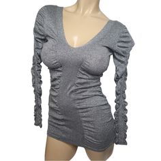 Brand: Moda International Women's Size Small Glitter Plunge V Neck Long Sleeve Knit Bodycon Mini Dress Color: Silver Approximate Measurements: Length 28" Bust 13" Sleeve 24" Materials: 70% Cotton20% Polyester10% Metallic Fibre Imported, Made In China Condition New Without Tags Sku: Scw 9 Knit Mini Dress, Bodycon Mini Dress, Silver Glitter, Long Sleeve Knit, Colorful Dresses, Womens Sizes, Dress Es, Dresses Skirts, Glitter