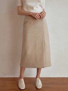 This product is a sophisticated wool skirt, designed with a sleek, midi-length cut that offers a modern take on classic styling. The skirt's high waist and straight silhouette provide a flattering fit, while the wool material ensures warmth and comfort. The high-waisted design is both flattering and practical, providing a comfortable fit that's ideal for all-day wear.Its straight cut and midi length create a streamlined look that's versatile for office wear or formal events.Crafted from qua Wool Skirt, Wool Skirts, Office Wear, Straight Cut, Midi Length, High Waisted Skirt, Comfort Fit, High Waist, Sleek