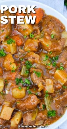 a white bowl filled with stew and vegetables