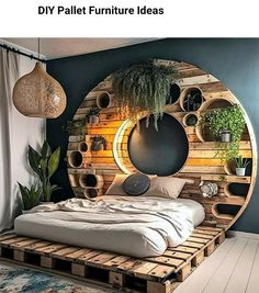 a bed made out of wooden pallets with plants in the middle and on top