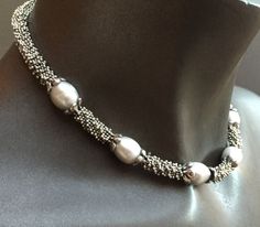 The necklace is 16.5 inches long. It is a classic combination of big white rice pearls and sterling silver beads. It sits comfortably on your neck and would be appropriate for a wedding, dinner out, or the office! It would be a perfect bridesmaid gift or birthday present for a June birthday. Great christmas present for someone special, too. Elegant Silver Beaded Necklaces With Round Beads, Elegant Silver Pearl Necklace With Silver Beads, Formal Silver Beaded Necklace With Polished Beads, Elegant Polished Pearl Necklace For Anniversary, Silver Single Strand Necklace For Formal Occasions, Classic Silver Beaded Necklaces With Pearl Pendant, Silver Oval Beads Jewelry For Formal Occasions, Elegant Silver Beaded Necklaces With Polished Beads, Elegant Pearl Necklace With Silver Round Beads