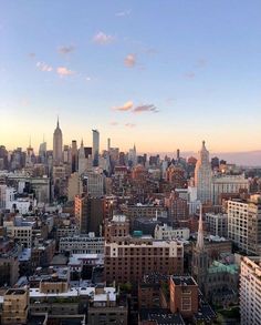 an aerial view of new york city at sunset