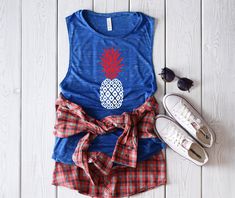 4th of july pineapple shrit, usa tank, fourth of July tank, patriotic tank, memorial day tank, 4th of July shirt, red white blue tank *T- SHIRT INFO* A fashion-forward tank in a super soft and flowy poly-viscose blend. The cropped and boxy silhouette, round neck and elongated arm holes make this style perfect for layering. Offered in a variety of solid, neon and striped colors. Features: Sideseamed. Boxy fit. Cropped body length. *FABRICATION* 65% Polyester, 35% Viscose Marbles are 3.5 oz., 91/9 Patriotic Blue Tops For Summer, Blue Patriotic Tops For Summer, Blue Patriotic Summer Tops, Casual American Flag Print Tank Top, Casual 4th Of July Graphic Print Tank Top, Patriotic Cotton Tops For Vacation, Casual 4th Of July Graphic Tank Top, Patriotic Tops For 4th Of July Vacation, Casual Graphic Print Tank Top For 4th Of July